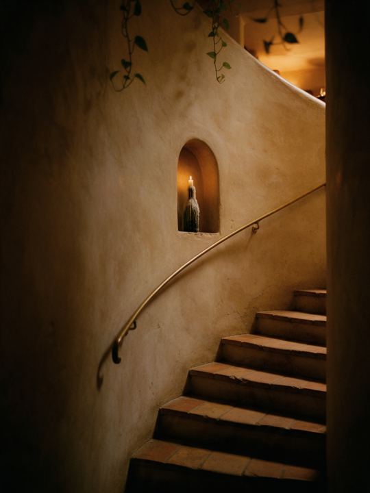 Downstairs, by candlelight.