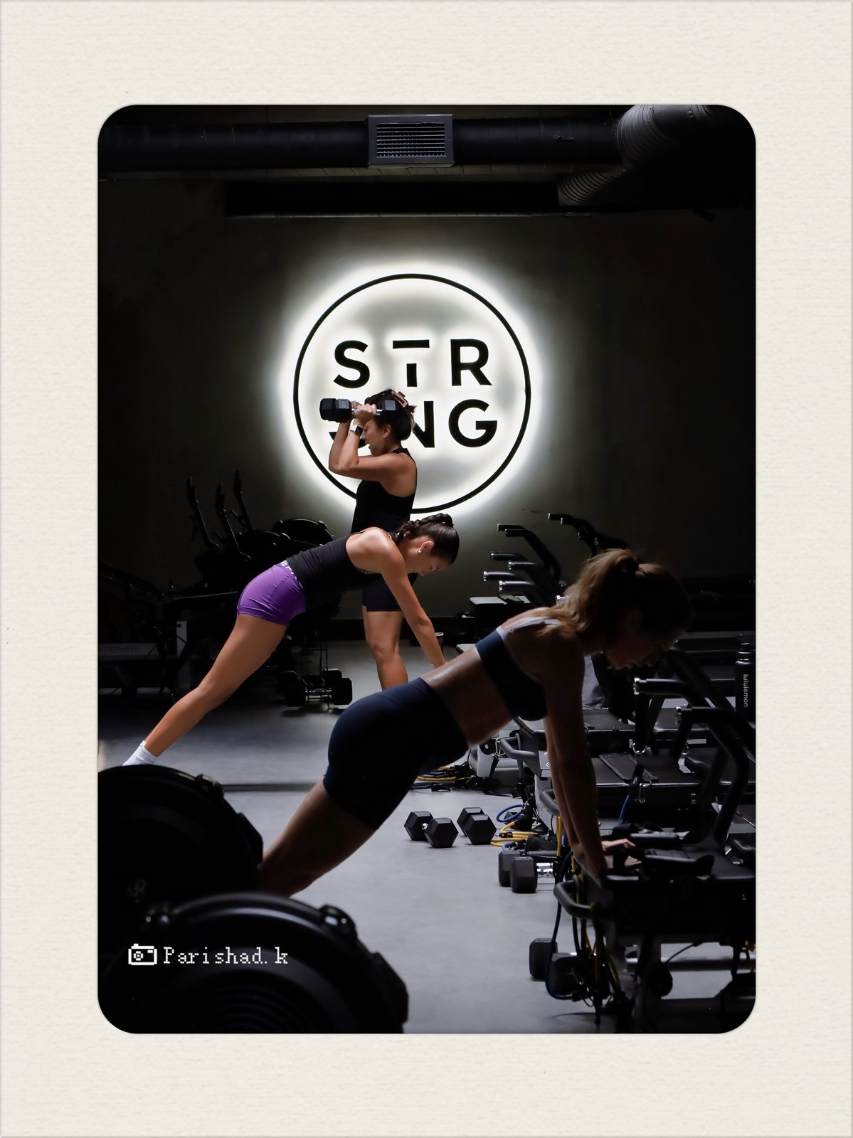 Class in motion beneath the STRONG sign